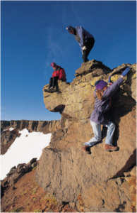 Women climbing on a hill